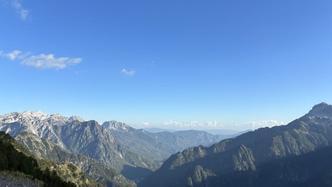 a view of the mountains from the top of a mountain