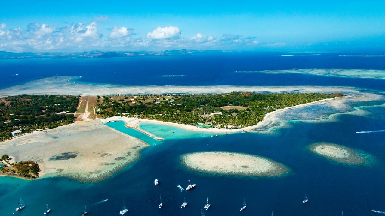 an aerial view of an island in the middle of the ocean