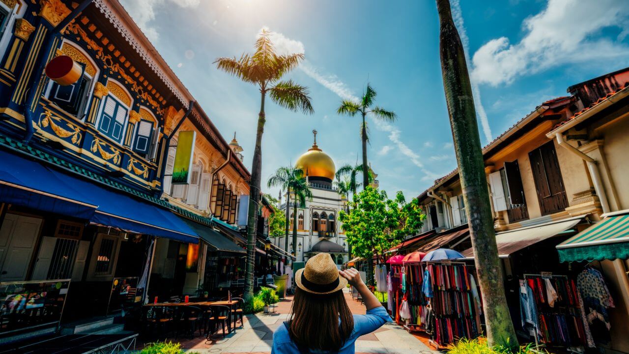 a person is taking a picture of a street in singapore