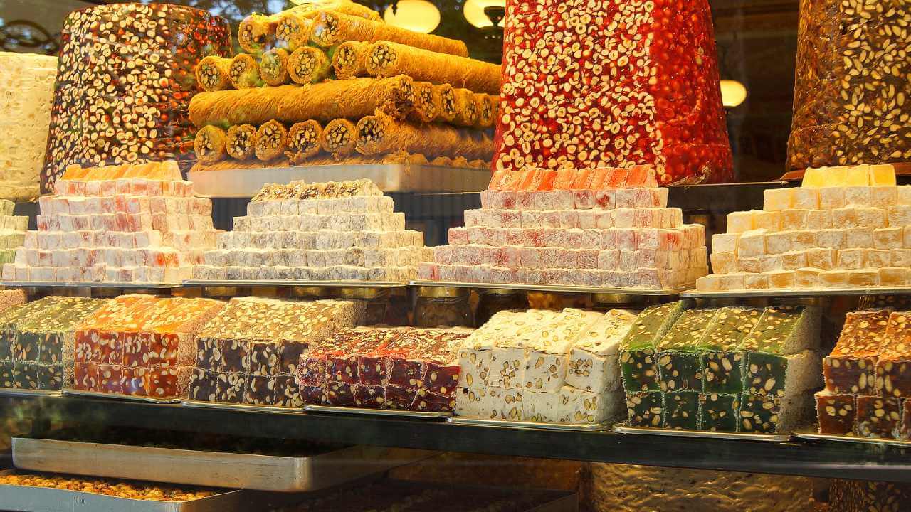 many different types of candy on display in a store window