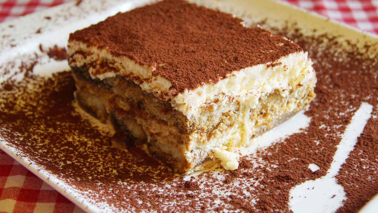 a piece of tiramisu on a white plate