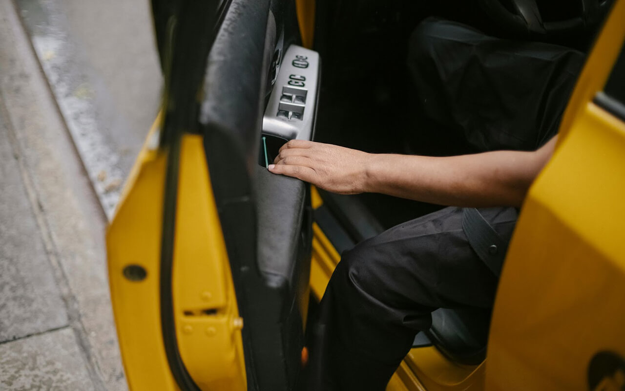 Driver opening the car door