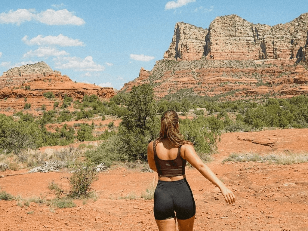 a person is walking through the red rocks in sedona, arizona