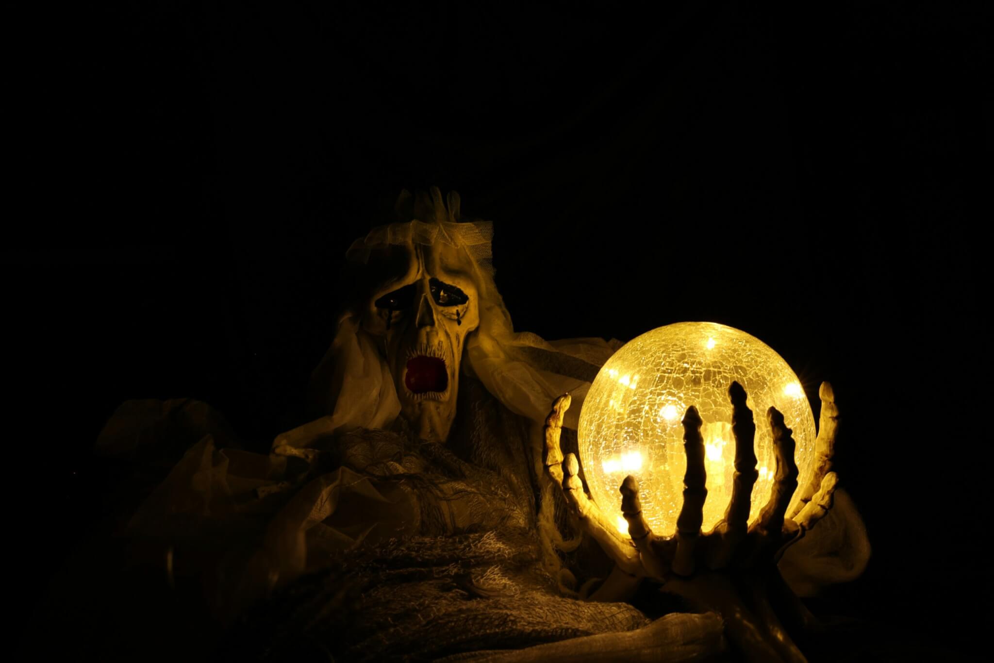 ghost holding a ball of light