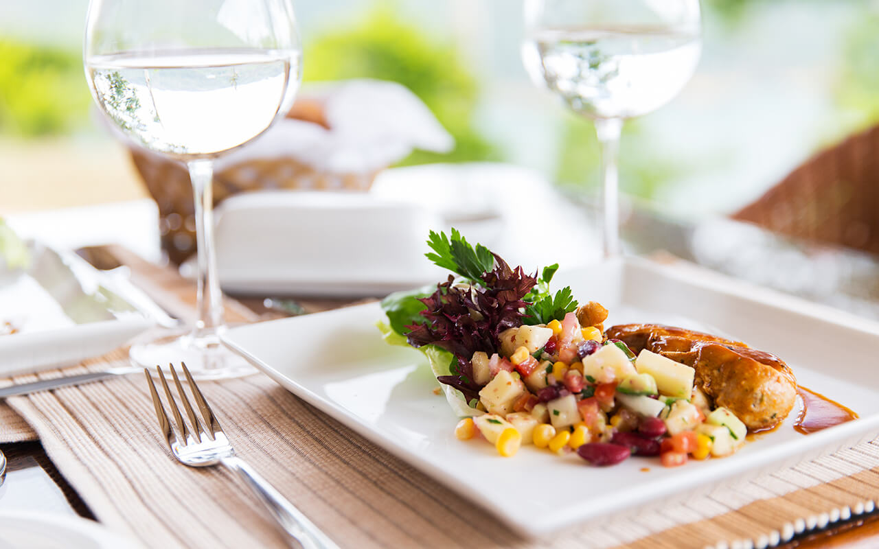 close up of food and water glasses at restaurant