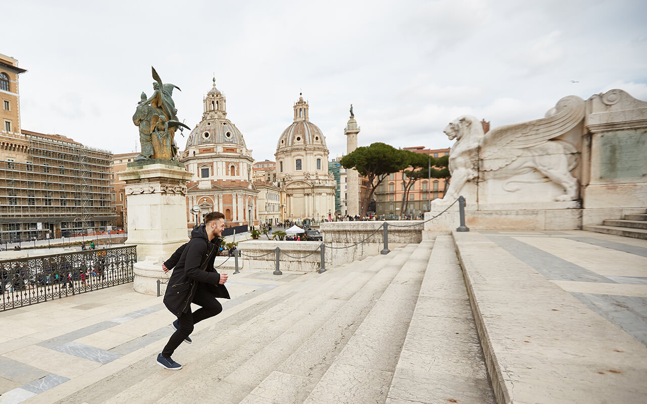 The guy quickly runs up the stairs in the Italian city of Rome