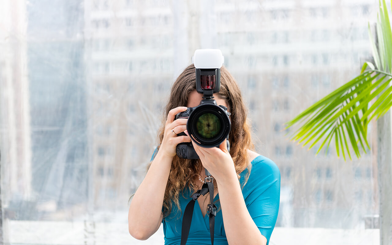 Woman taking a photograph with a camera