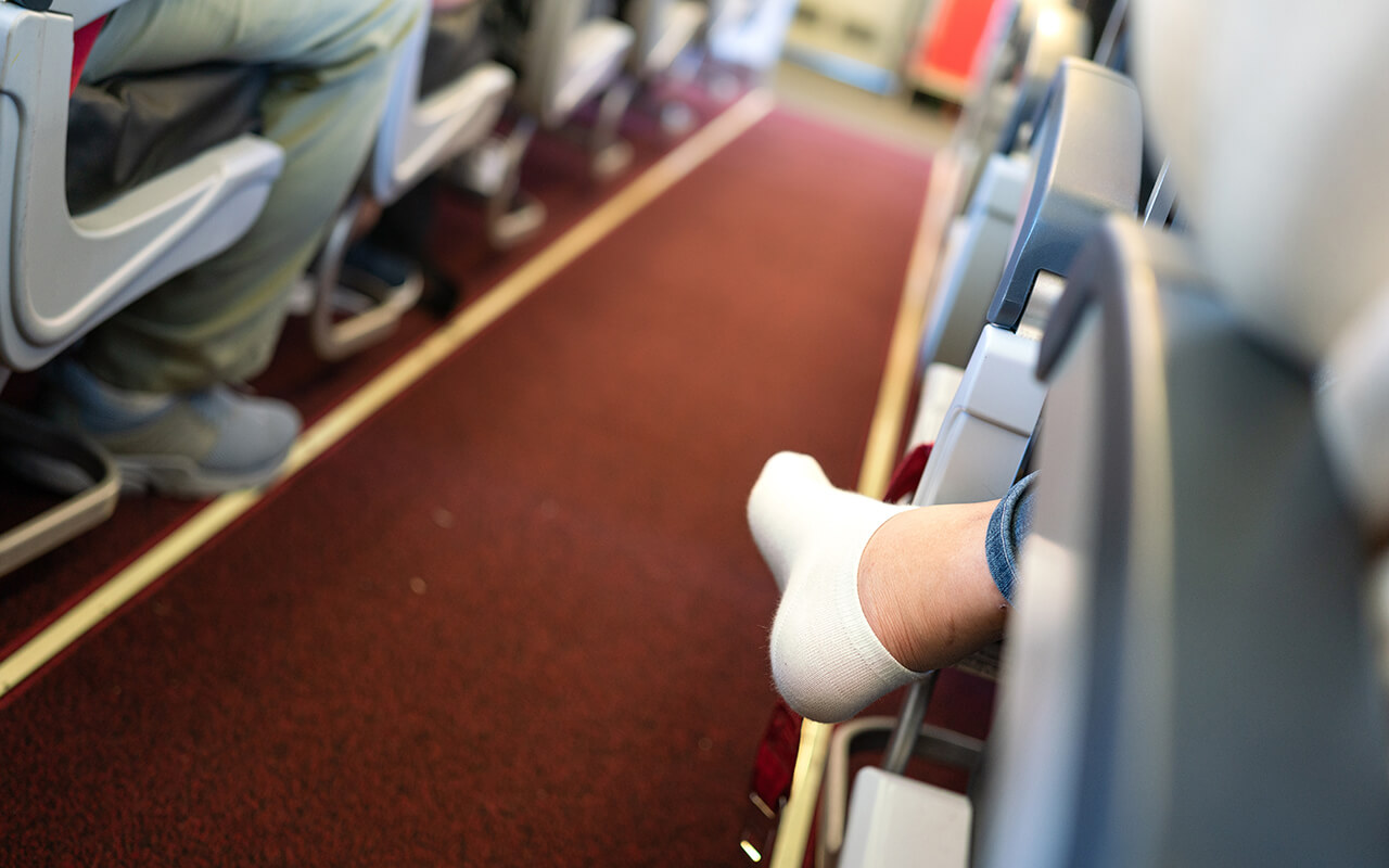 Woman with her shoes off on an airplane