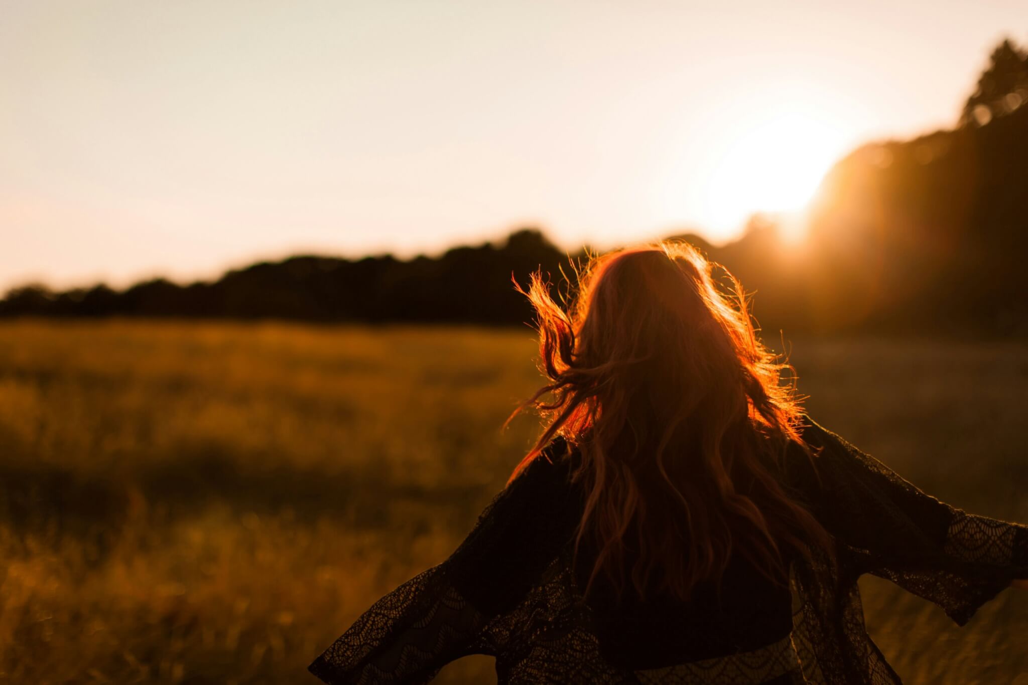 woman standing in the sun