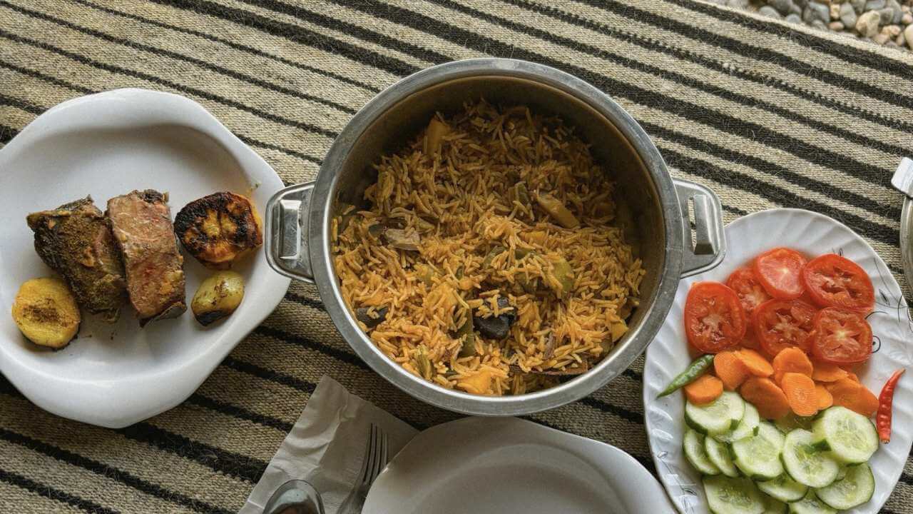 a table topped with plates of food and utensils