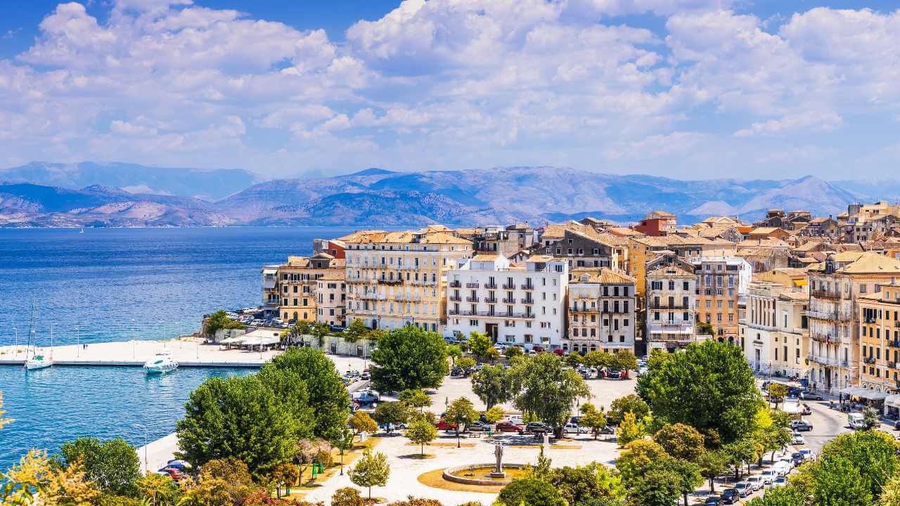 the city of chania in greece with the sea and mountains in the background