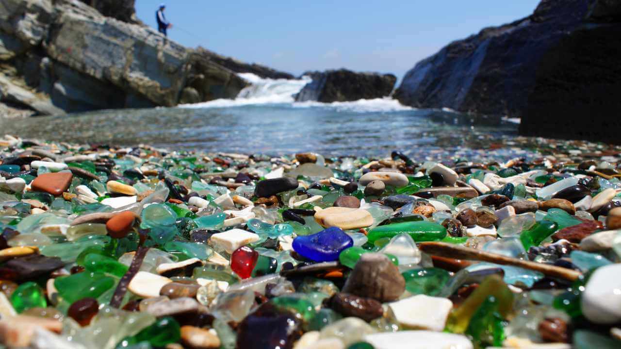 a beach with lots of glass on it