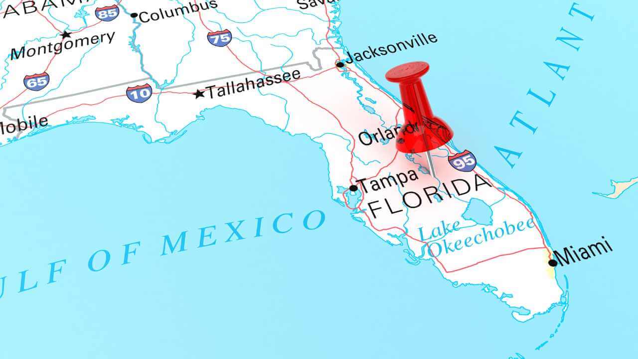 a map of florida with a red pin pointing to the state