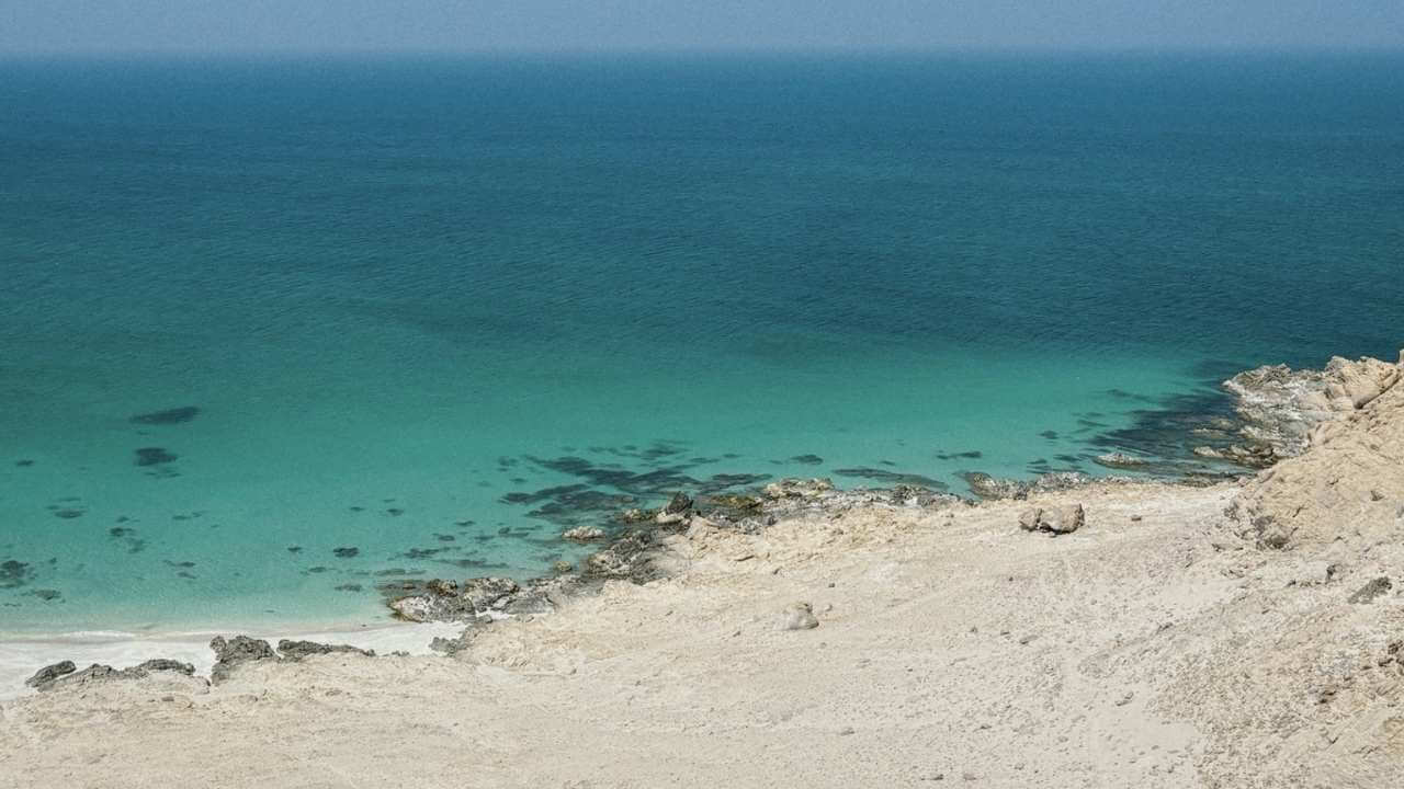 the view from the top of a cliff overlooking the ocean