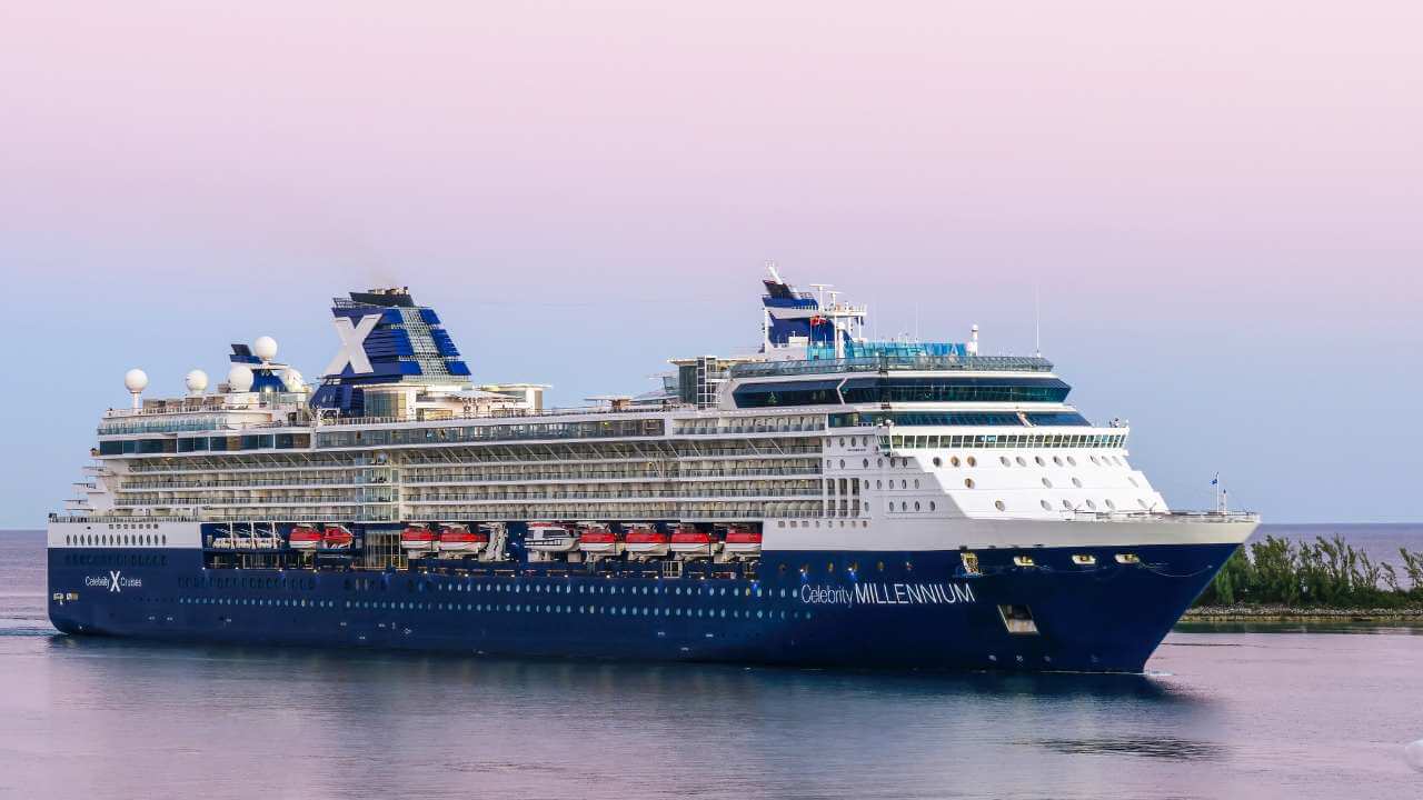 a large blue and white cruise ship in the ocean