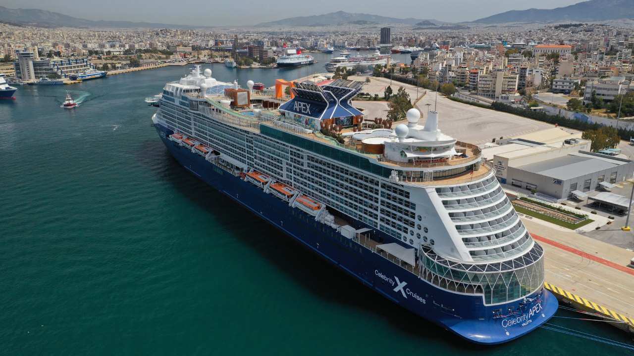 an aerial view of a cruise ship docked in a port