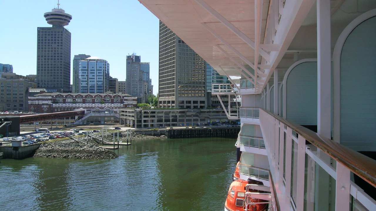 a view of the city from the balcony of a cruise ship