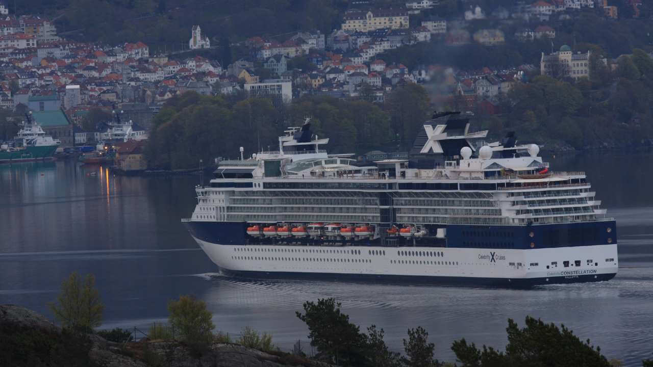 a large cruise ship in the middle of a body of water