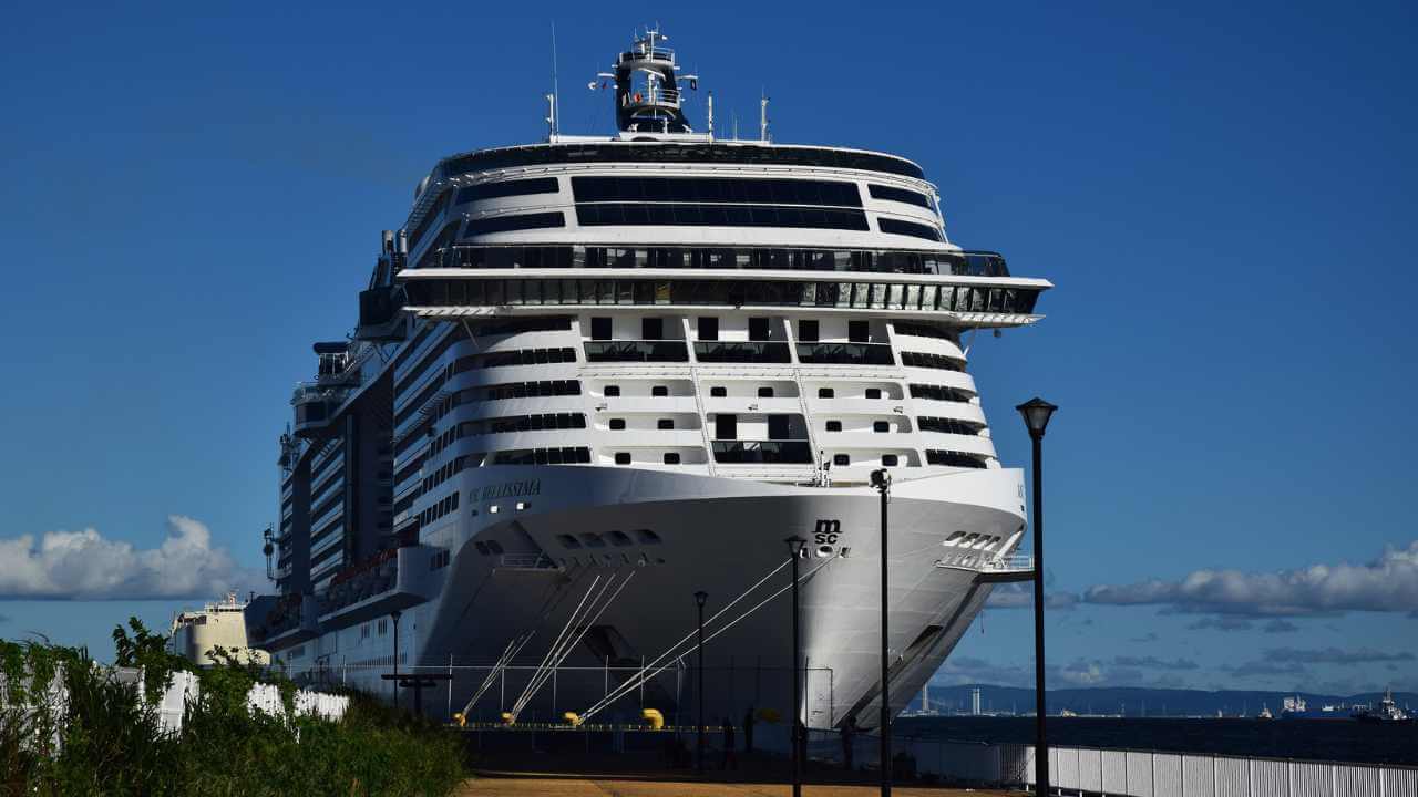 a large cruise ship is docked at the dock