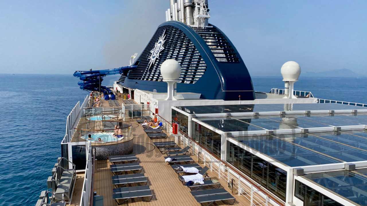 the top deck of a cruise ship with sun loungers