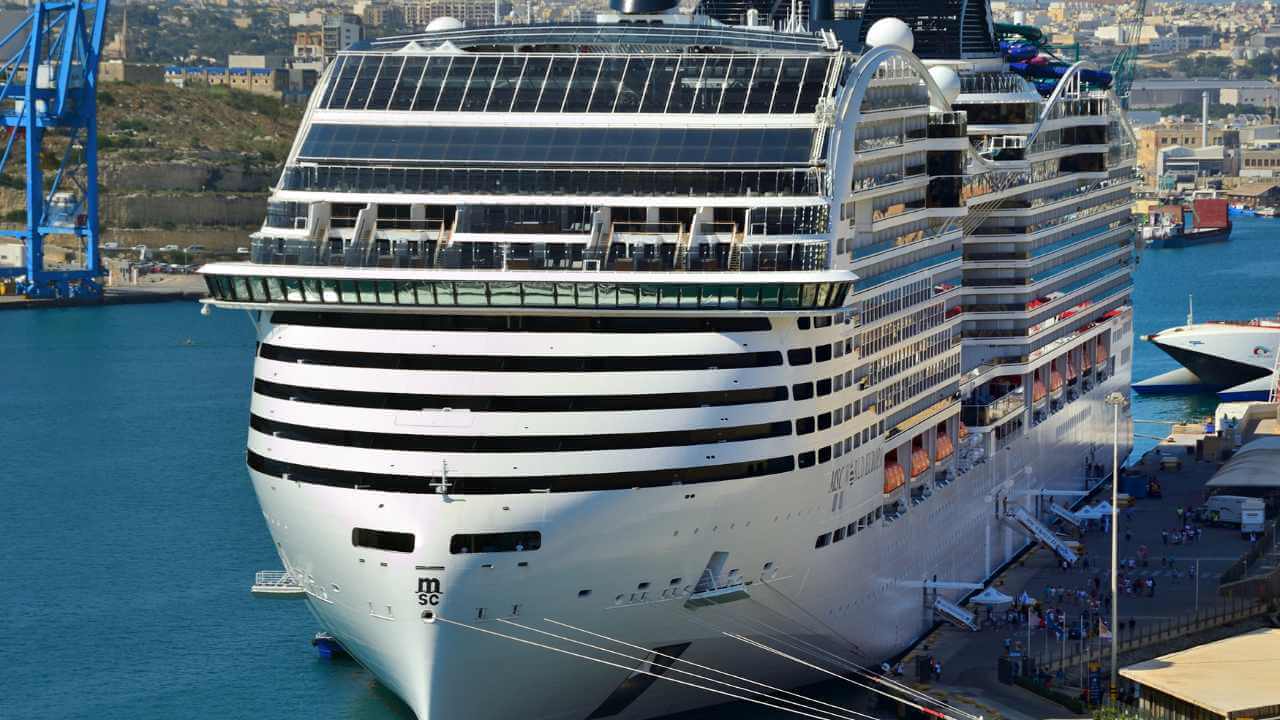 a large cruise ship docked in a harbor