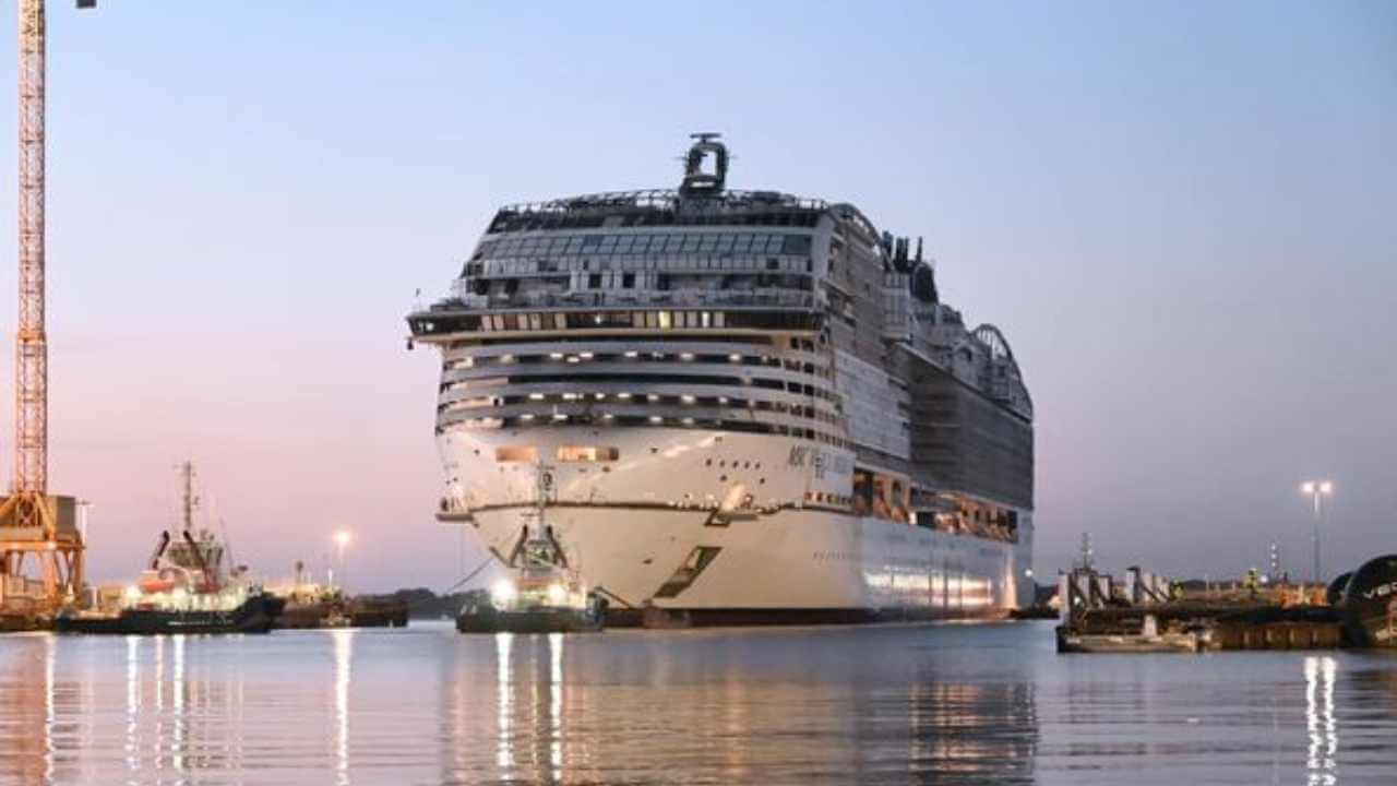 a large cruise ship docked at a dock