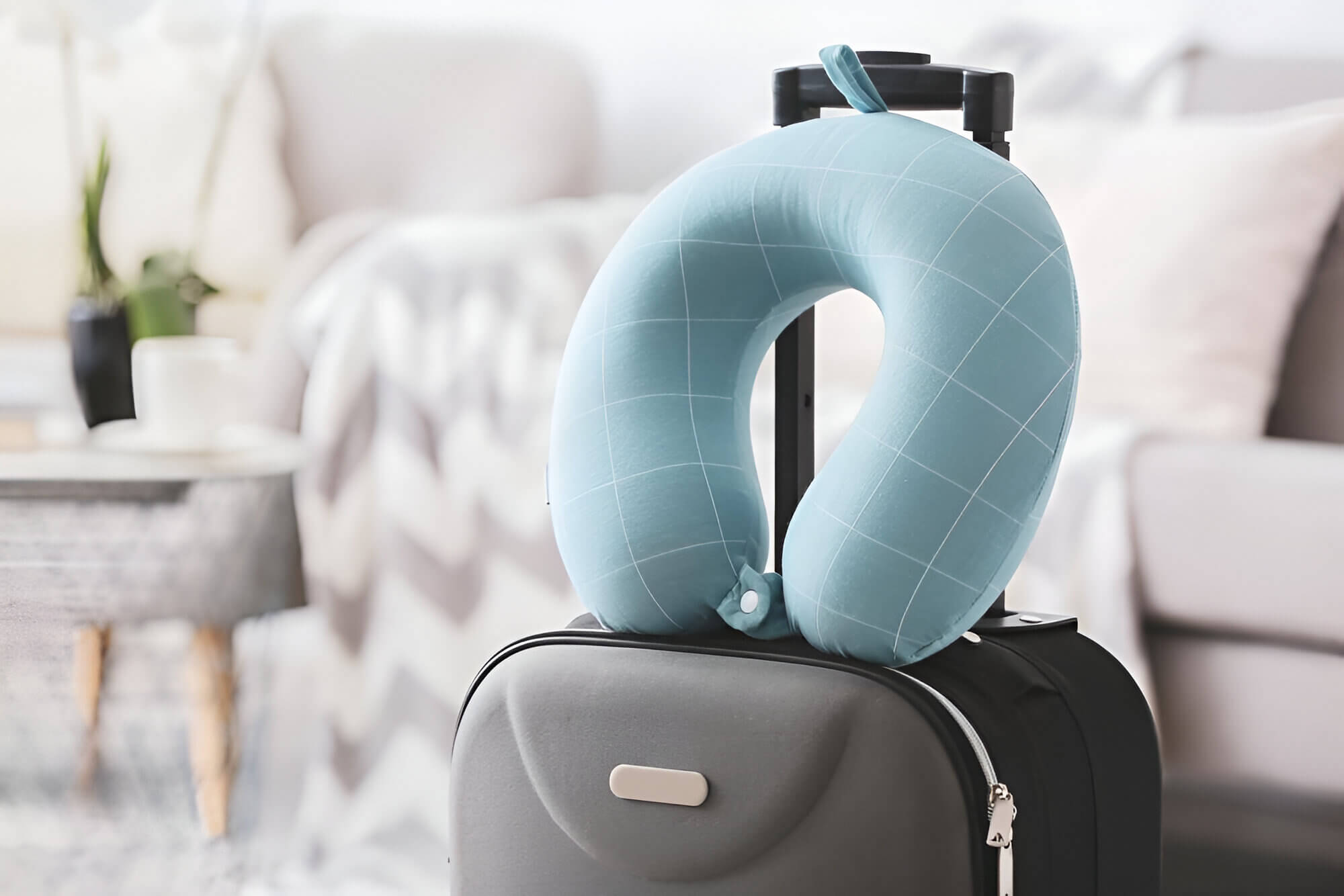 neck pillow on luggage