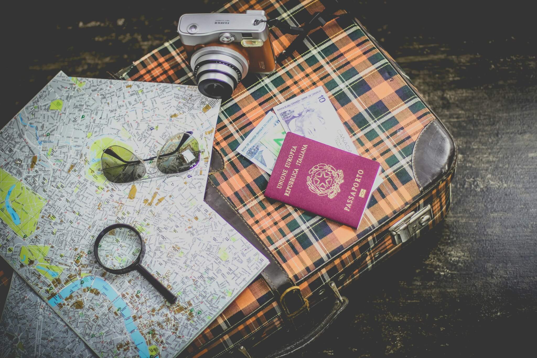 passport and map on suitcase