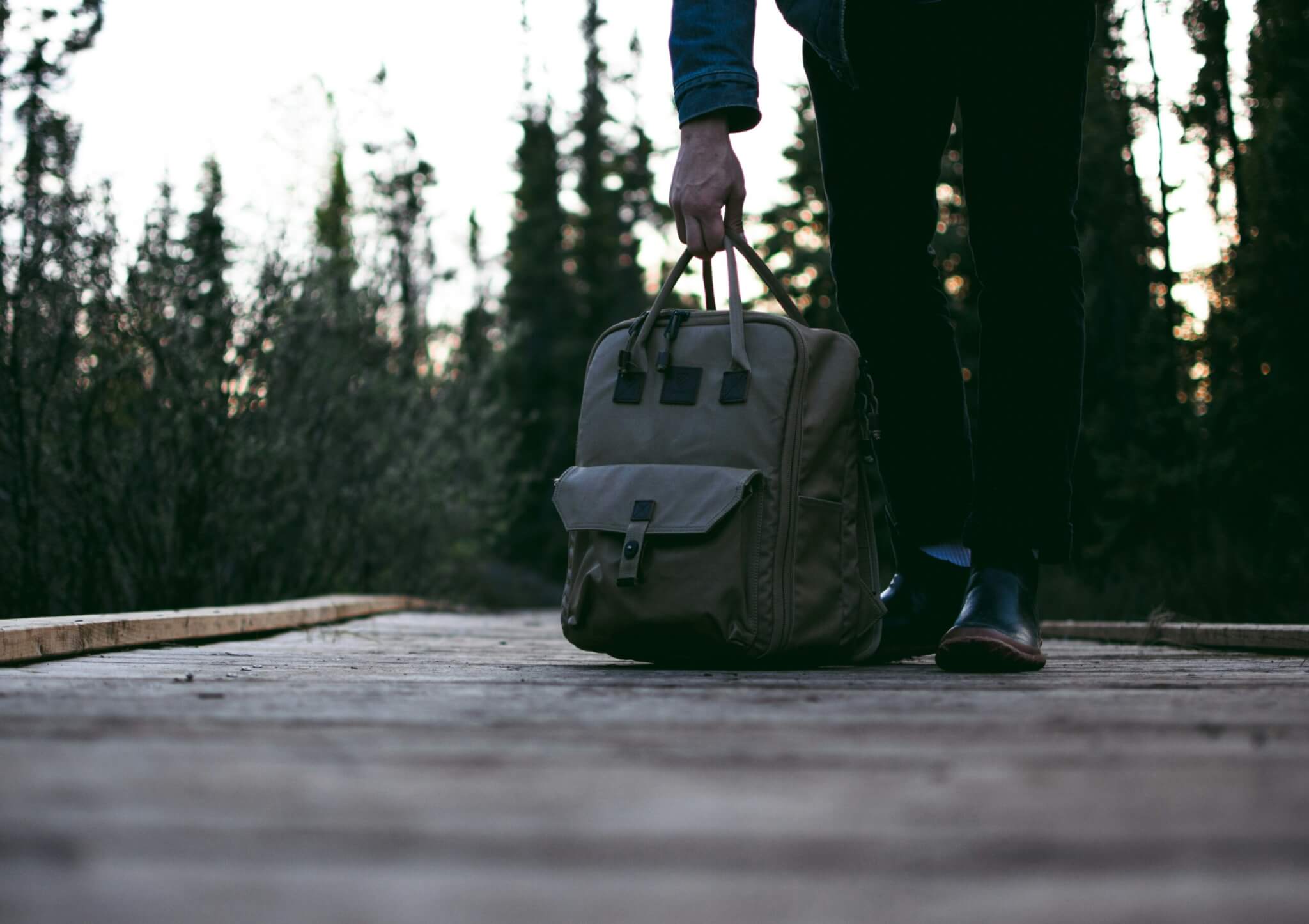 man holding a backpack