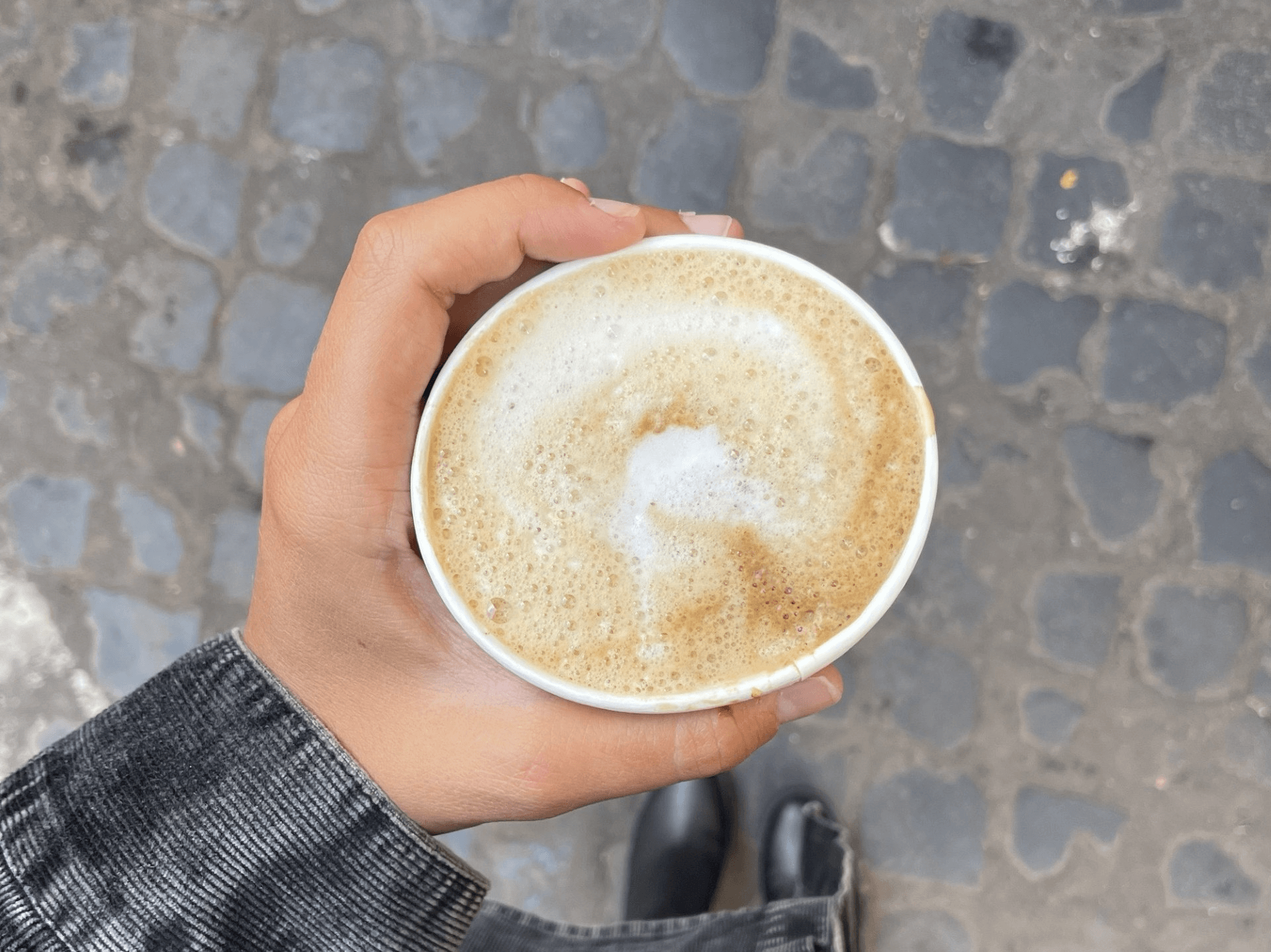 person holding a cup of coffee