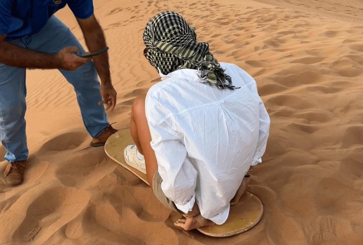 woman on a board in the sand