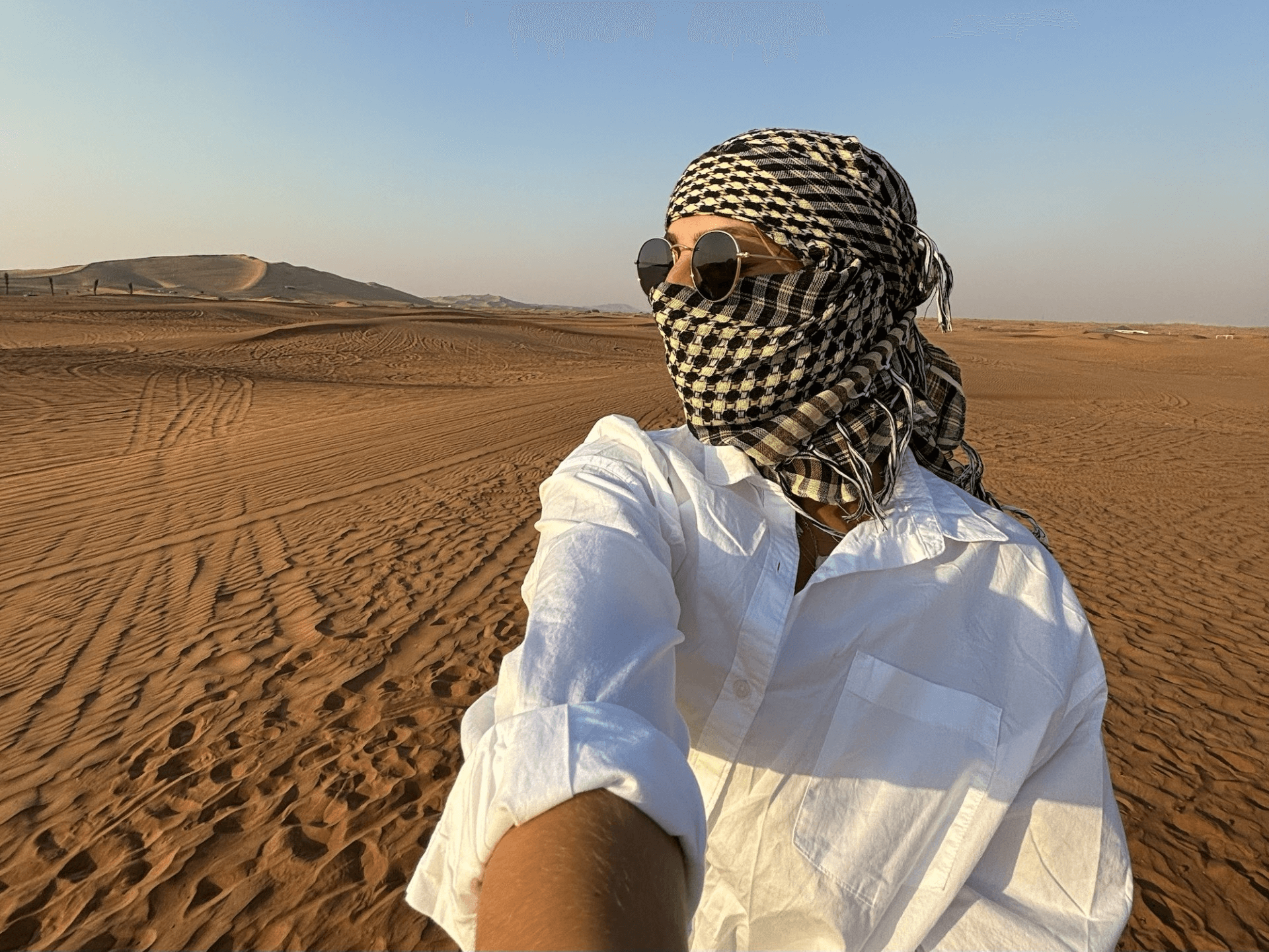 woman in the sand dunes of dubai