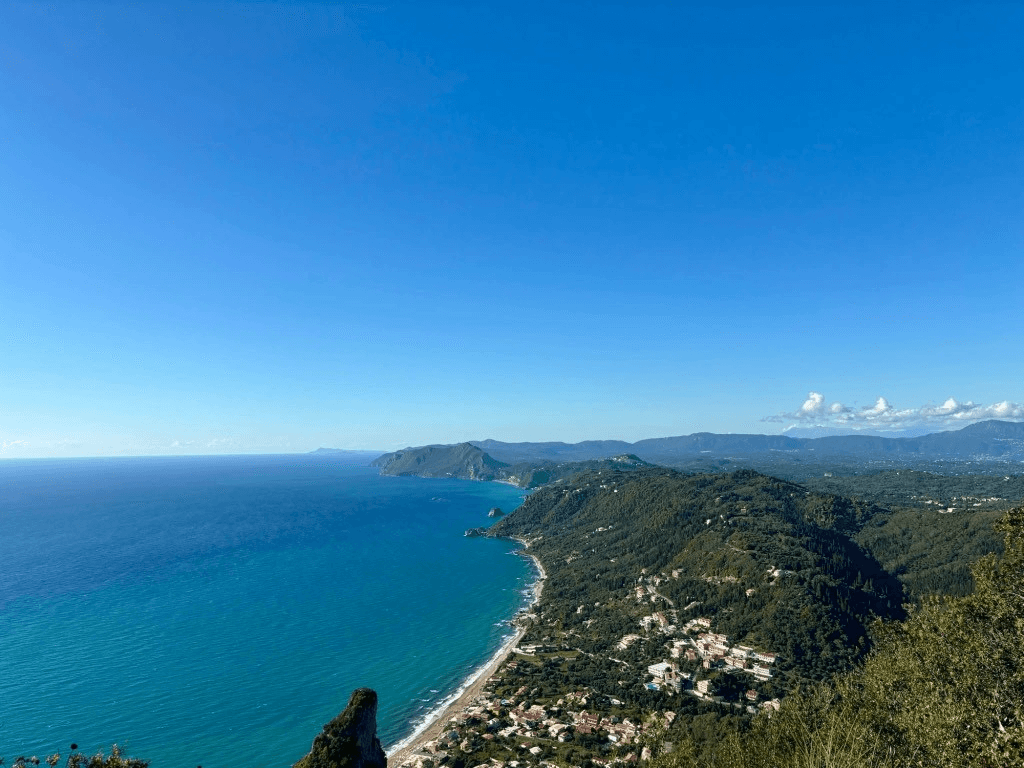 view from the top of a mountain overlooking the water