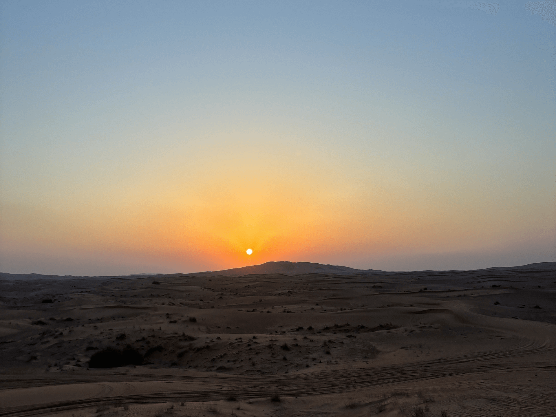 sunset behind mountains