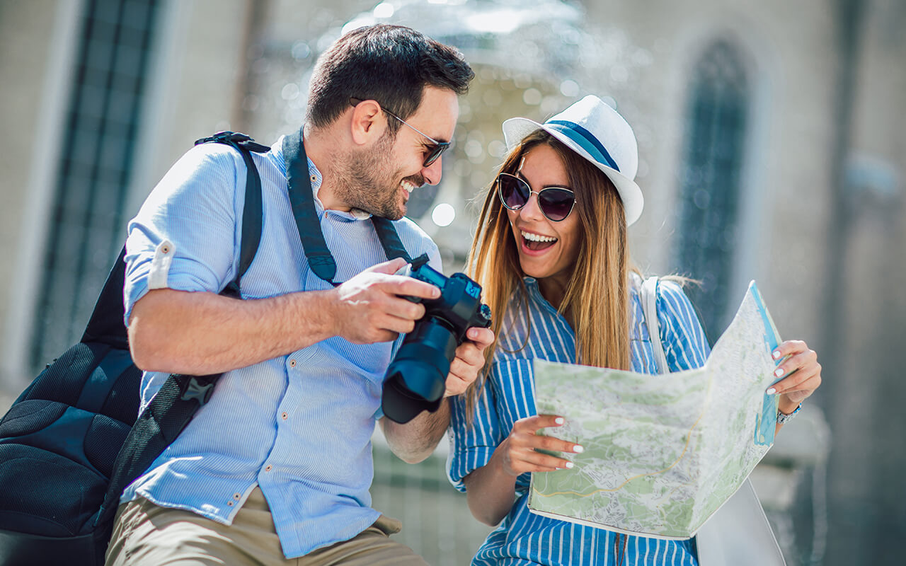 Tourists with a camera and map