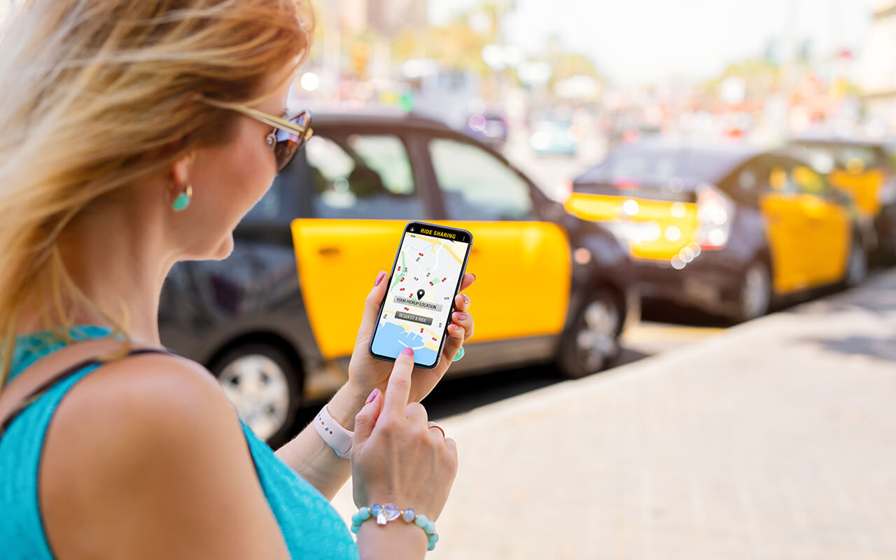 Woman setting up an Uber ride