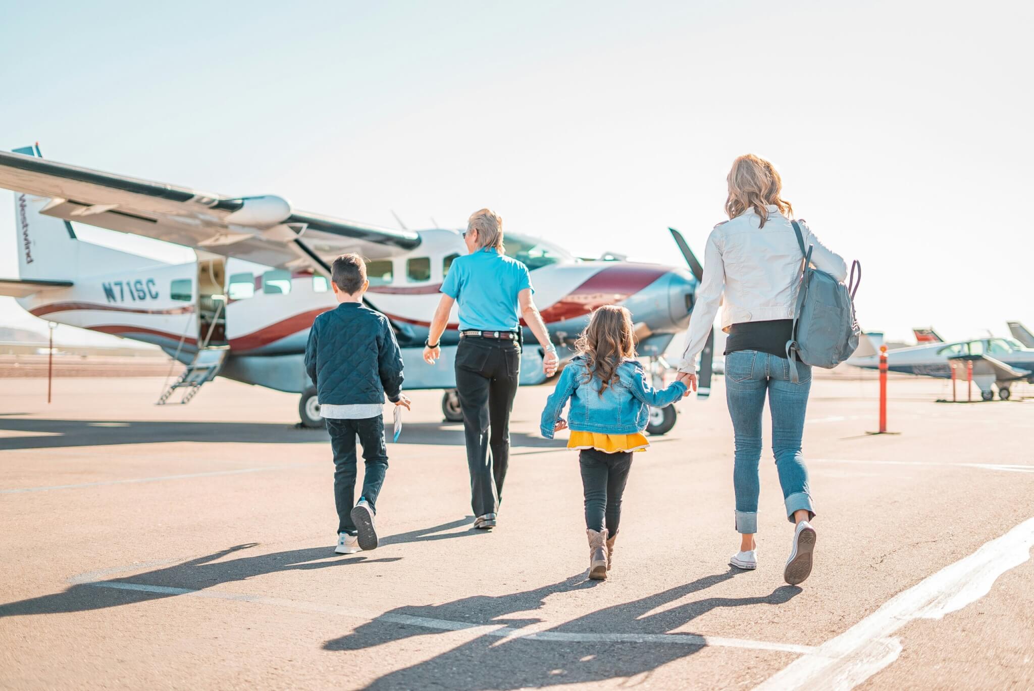 family boarding an airplane