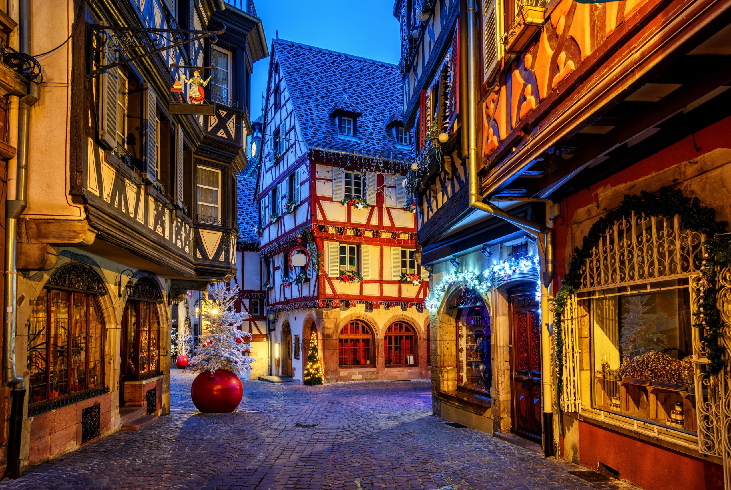 Traditional Christmas decorations and lights in Colmar Old Town, Alsace, France at night
