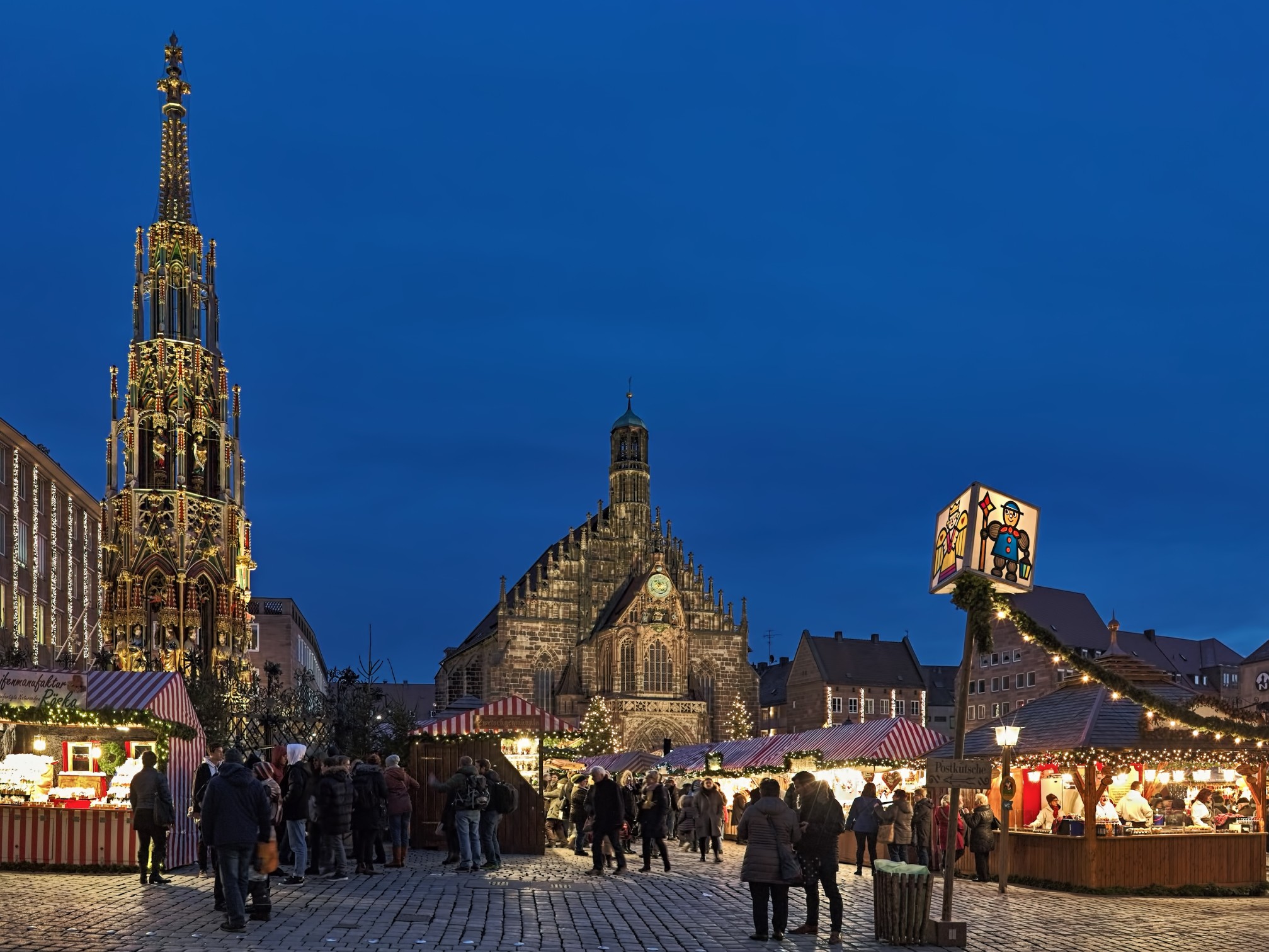 Nuremberg, Germany. Christkindlesmarkt Christmas market at Hauptmarkt platz (Main Market Square) in dusk.
