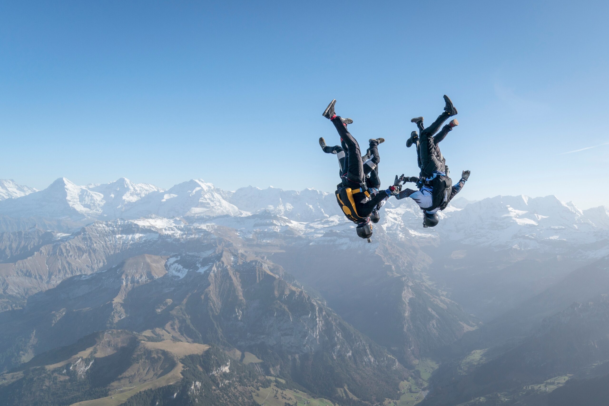 Skydivers perform stunts over Swiss Alps
