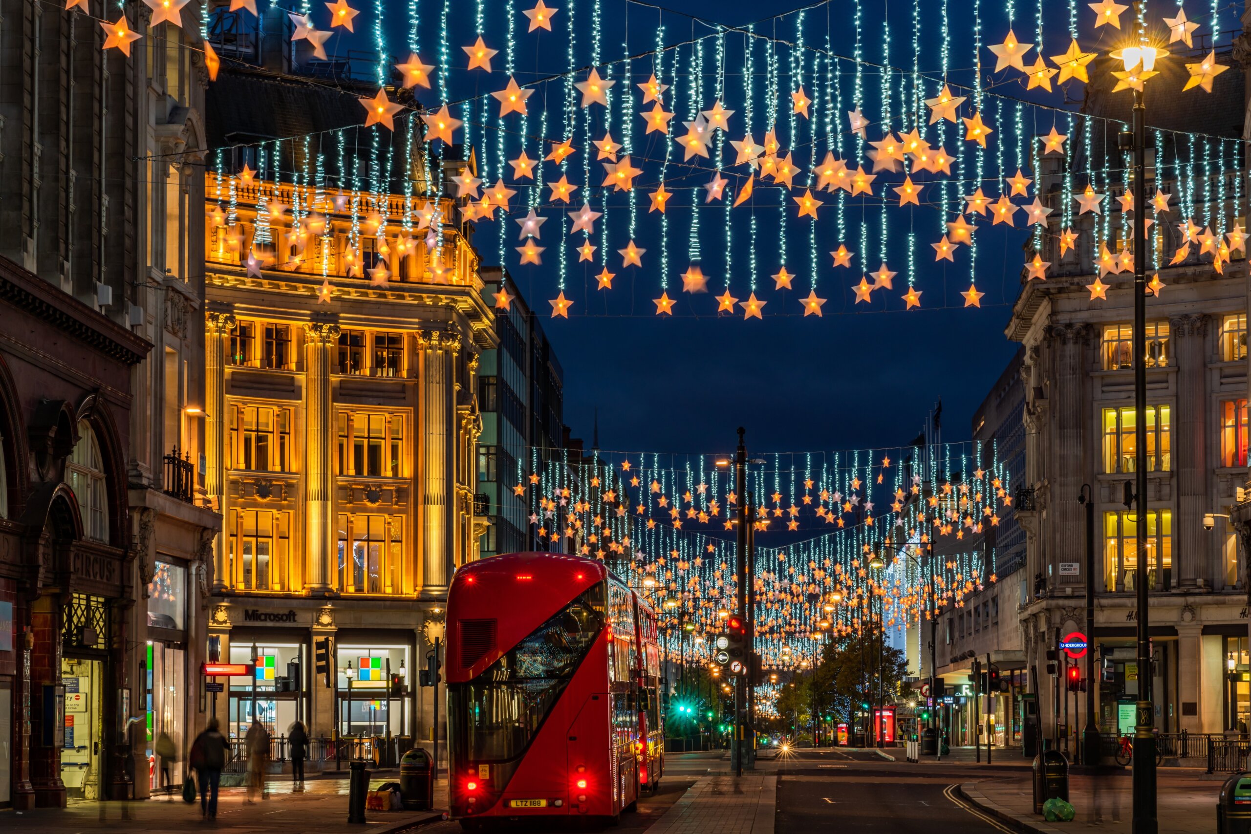 LONDON - NOVEMBER 13, 2021: Oxford Street in London is decorated with sparkling stars draped over the length of the street for Christmas this year.
