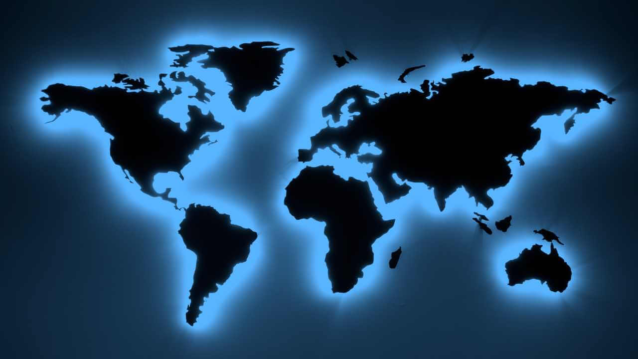 the world map is glowing blue on a dark experience