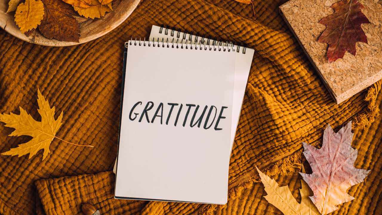 gratitude notebook with autumn leaves