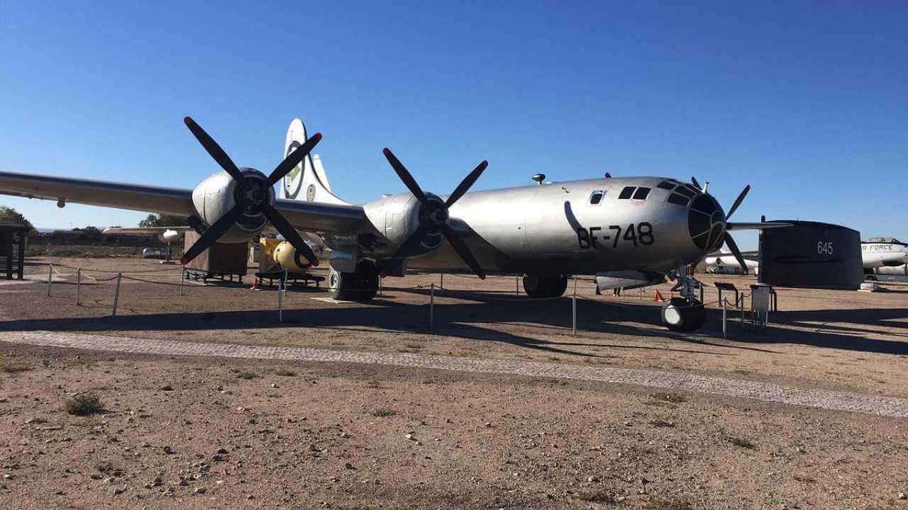an old airplane is parked on the ground