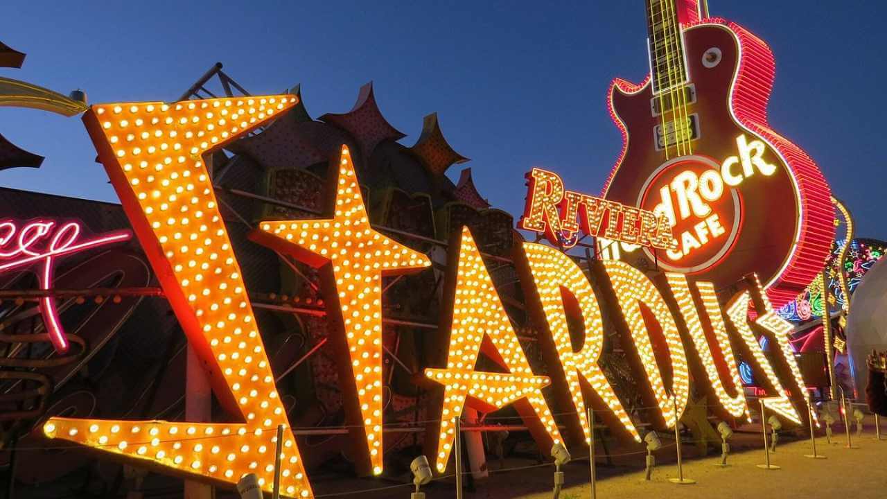 the neon sign for starlight casino is lit up at night
