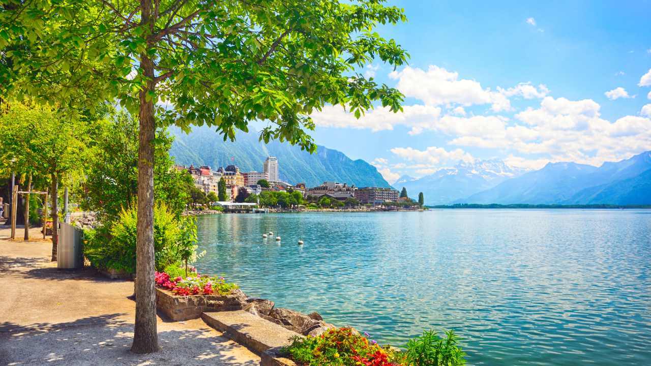 a beautiful view of the lake with mountains in the background