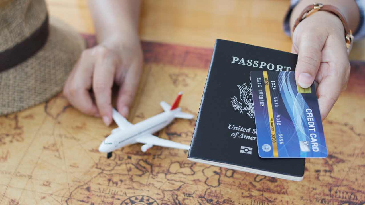 passport and credit card on a map