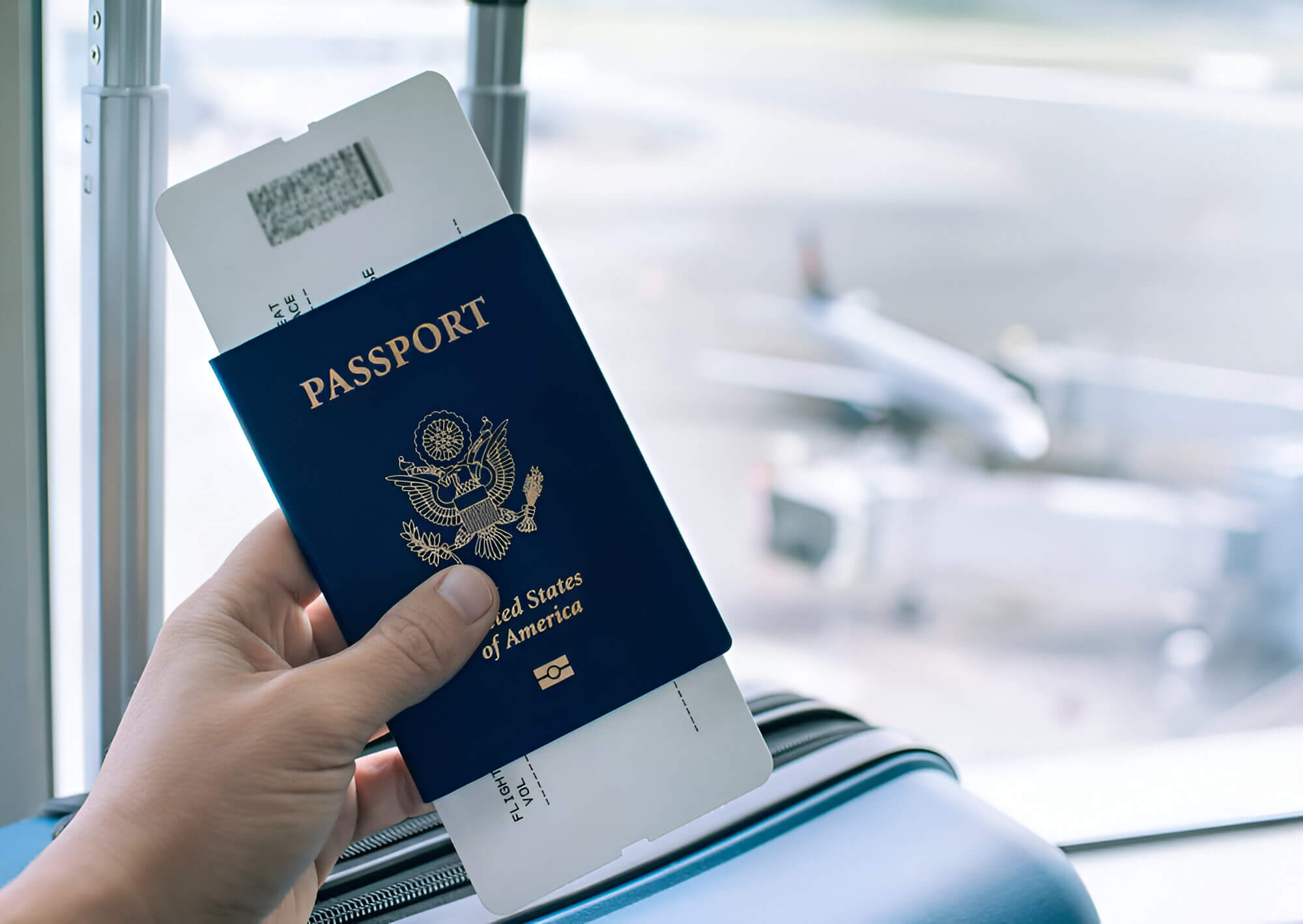 passport or airplane boarding pass in hand