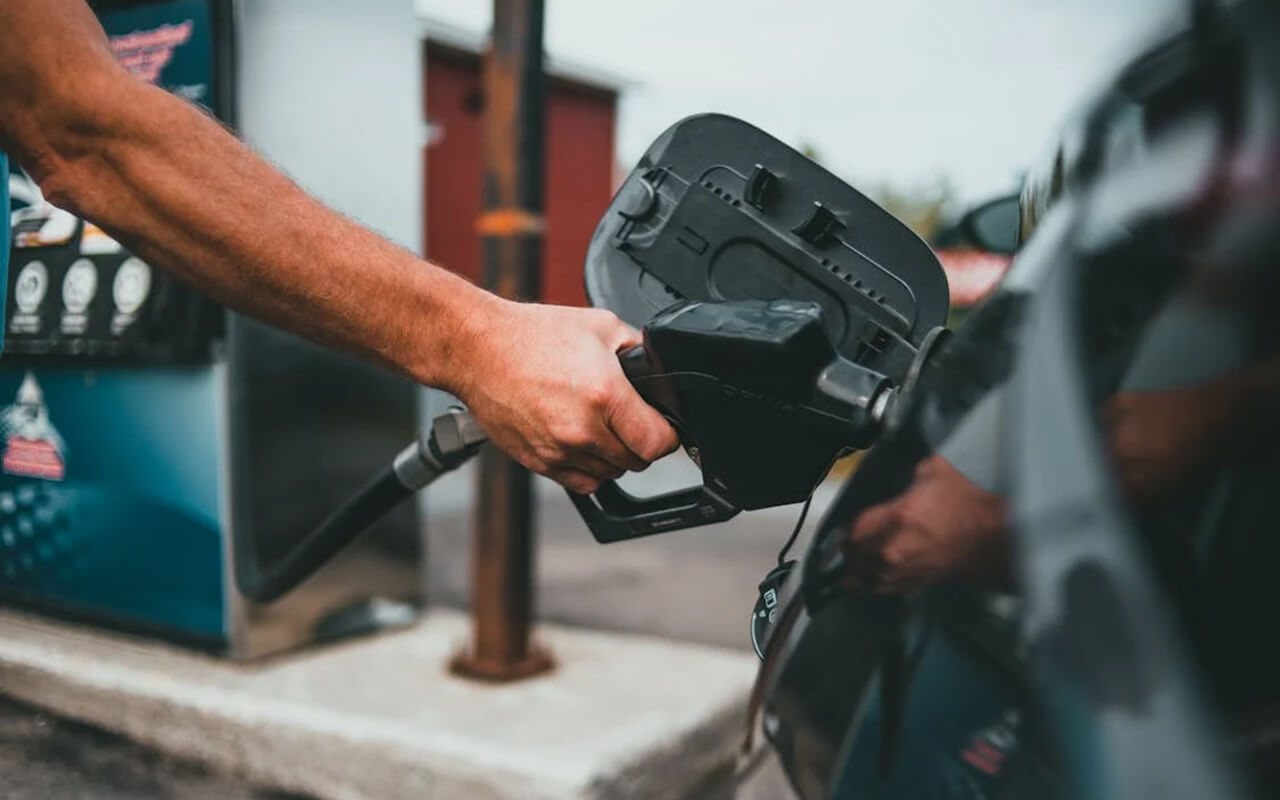 Man filling his car with gas