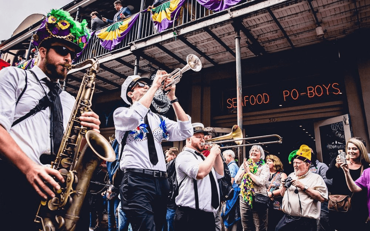 men playing instruments in a mardi gras parade